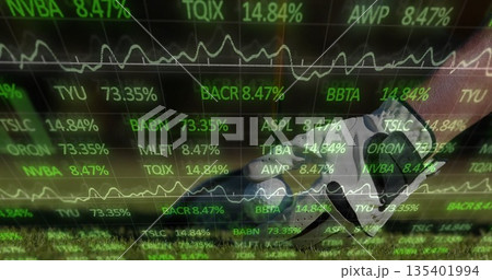 Stepping soccer cleat with shin guard on sports field turf, with stock ticker overlay, copy space Stepping soccer cleat with shin guard on sports field turf, with stock ticker overlay, copy space 135401994
