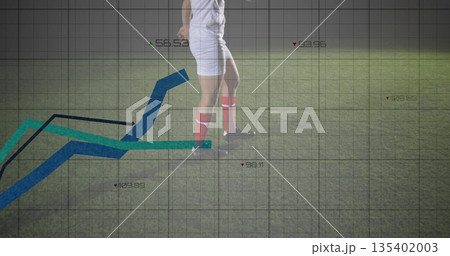 Showing soccer player's legs wearing white kit, red socks running on grass pitch with grid overlay 135402003