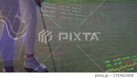 Visualizing woman golfer analyzing data overlays on putting green, with golf club, copy space 135402009