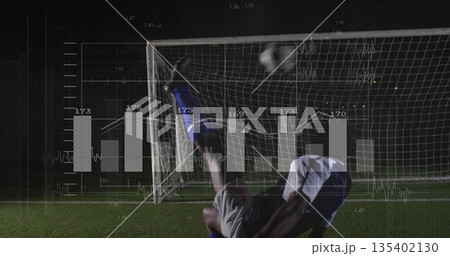 Executing bicycle kick soccer player sending ball toward goal on grass under lights, with analytics 135402130
