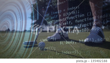 Positioning golfer's lower legs over golf ball on putting green, with putter head and code overlay 135402188