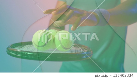 Holding racket balancing three balls, player wearing sleeveless shirt, wristband in pastel studio Holding racket balancing three balls, player wearing sleeveless shirt, wristband in pastel studio 135402334