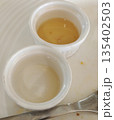 Small dipping bowl completely emptied after meal 135402503