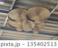 Ceiling bamboo lamp casting warm decorative light 135402513