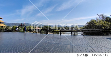 Large wooden balcony overlooking scenic landscape and beautiful view, AI Generated 135402515