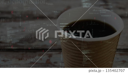 Displaying corrugated coffee cup holding dark coffee on weathered table, code overlay, copy space 135402707