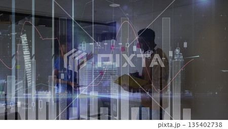 Gesturing professionals discussing bar graphs on glass walls in office with yellow folder, skyline 135402738