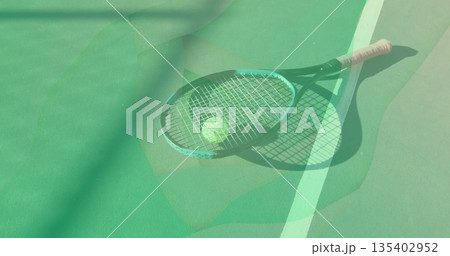 Lying tennis racket with pink grip holding tennis ball on hard court, white court boundary line Lying tennis racket with pink grip holding tennis ball on hard court, white court boundary line 135402952