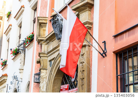 Poland Flag on old house building in Krakow Poland Flag on old house building in Krakow 135403056
