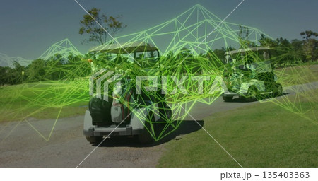 Showing two golf carts carrying bags on gravel path at golf course, with green wireframe overlay 135403363