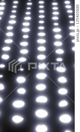 Rows of soft glowing dots forming a bright futuristic surface with subtle depth and smooth light blur 135403880