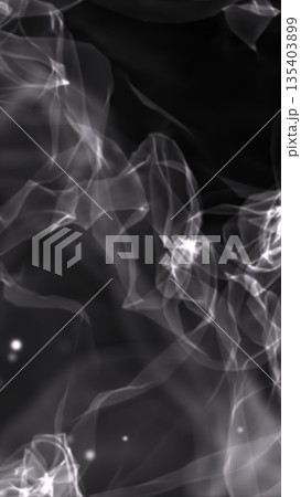 Smooth flowing translucent grey smoke forming soft drifting shapes on a dark background Smooth flowing translucent grey smoke forming soft drifting shapes on a dark background 135403899