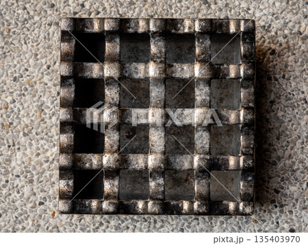 A cast metal box is used as an ashtray A cast metal box is used as an ashtray 135403970