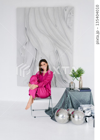 Smiling Woman In Pink Clothes With Silver Decor Smiling Woman In Pink Clothes With Silver Decor 135404010