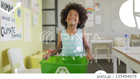 Standing child showcasing green recycling bin in school classroom, with climate awareness posters Standing child showcasing green recycling bin in school classroom, with climate awareness posters 135404079