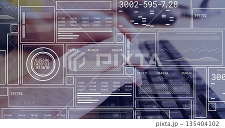 Typing software developer hands entering data on laptop keyboard at wooden desk, with data overlays 135404102