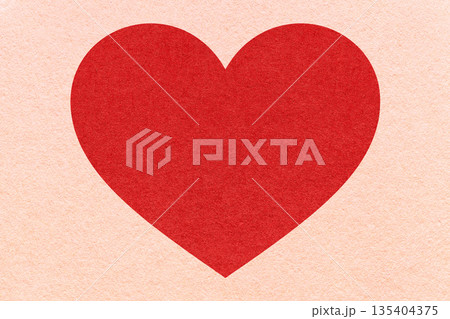 Red heart on peach paper texture background with copy space for Valentines Day banner, template or greeting card Red heart on peach paper texture background with copy space for Valentines Day banner, template or greeting card 135404375