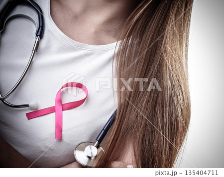 woman chest with pink cancer ribbon 135404711