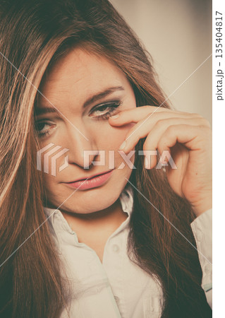 Sad woman cry alone and touch face. Sad woman cry alone and touch face. 135404817