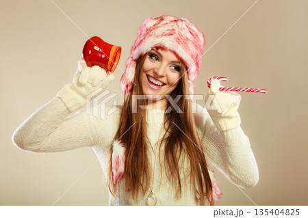 Girl playing with cane and mug. Girl playing with cane and mug. 135404825