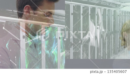 IT specialist checking rack servers inside data center hall, with network graphics, copy space 135405607