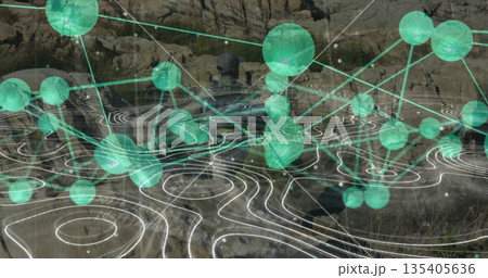 Exploring lone man navigating rocky canyon by water, glowing green data nodes with contour lines 135405636