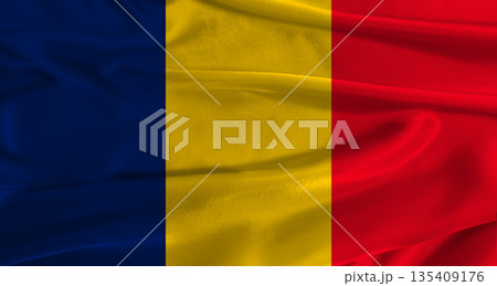 Flag of Chad with fabric textured background. Close up of National flag of Chad with realistic texture 135409176