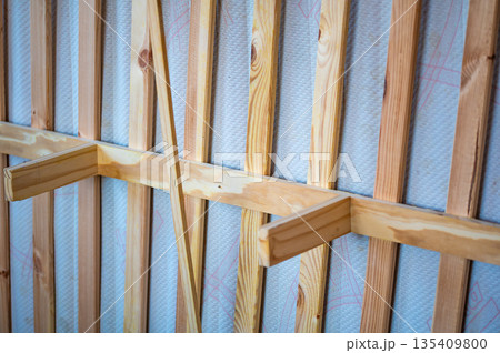 View of bottom part of wooden bed and the frame. View of bottom part of wooden bed and the frame. 135409800