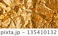 Gold foil texture with glossy crumpled surface 135410132