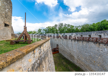 Ancient castle Trencin, Slovakia. Old fort on the hill, big walls and towers. Summer day, dramatic clouds before storm. 135410147