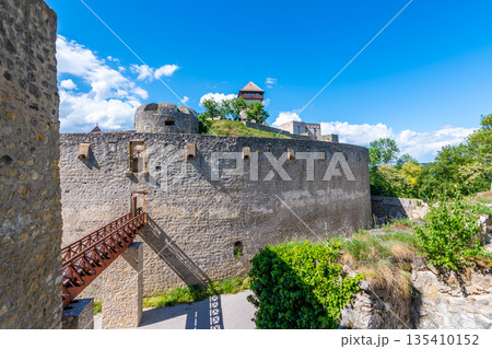 Ancient castle Trencin, Slovakia. Old fort on the hill, big walls and towers. Summer day, dramatic clouds before storm. Ancient castle Trencin, Slovakia. Old fort on the hill, big walls and towers. Summer day, dramatic clouds before storm. 135410152