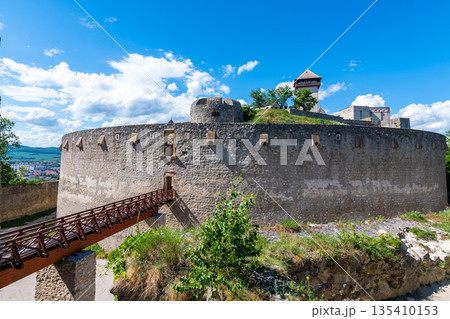 Ancient castle Trencin, Slovakia. Old fort on the hill, big walls and towers. Summer day, dramatic clouds before storm. 135410153