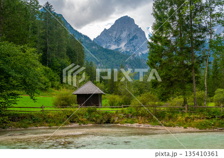 The Krumme Steyr river near the village Hinterstoder and famous lake Schiederweiher. Pure fresh water near Austrian Alps and mountains peaks. Soft colors, peace in nature. 135410361