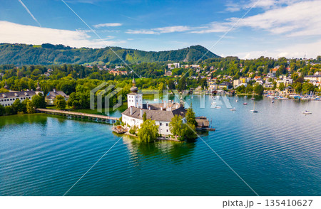 Schloss Ort (or Schloss Orth) is an Austrian castle situated in the Traunsee lake, in Gmunden. Aerial drone view. 135410627