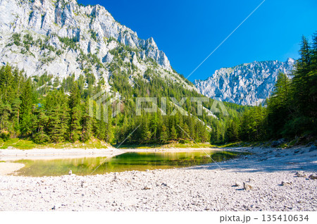 Gruner See, Austria Peaceful mountain view with famous green lake in Styria. Turquoise green color of water. Travel destination Gruner See, Austria Peaceful mountain view with famous green lake in Styria. Turquoise green color of water. Travel destination 135410634