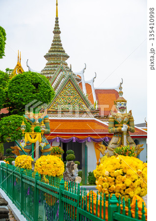 Wat Arun Ratchawararam Ratchawaramahawihan temple at Bangkok, Thailand. Buddhist temple, famous tourist destination. 135410998