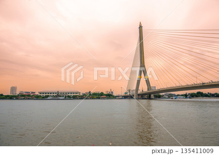 View of Bangkok bridge over the river during sunset time. View of Bangkok bridge over the river during sunset time. 135411009