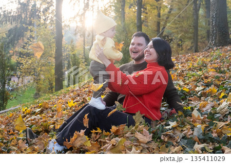 Family Enjoying Autumn in the Forest Family Enjoying Autumn in the Forest 135411029