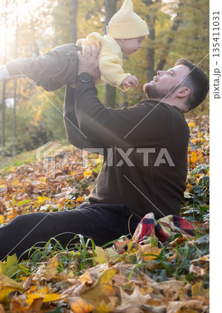 Father and Baby Enjoying Autumn in the Park 135411031