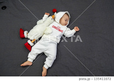 Sleeping Baby in Christmas Outfit 135411072
