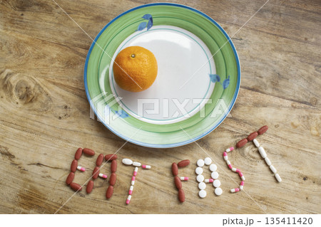 eat fast message with pills and half plate of food on table eat fast message with pills and half plate of food on table 135411420