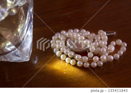 pearl necklace and precious stone 135411843