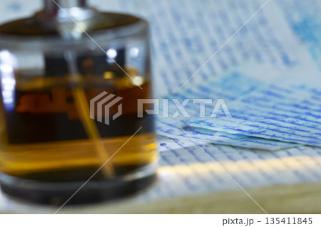 perfume bottle and handwritten paper perfume bottle and handwritten paper 135411845