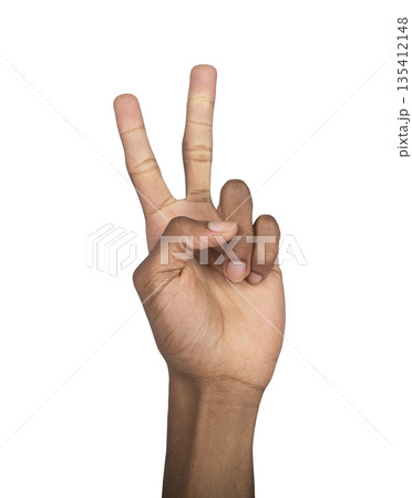 Hand raised in victory sign with two fingers up, peace gesture and positive symbol. African-American Hand raised in victory sign with two fingers up, peace gesture and positive symbol. African-American 135412148
