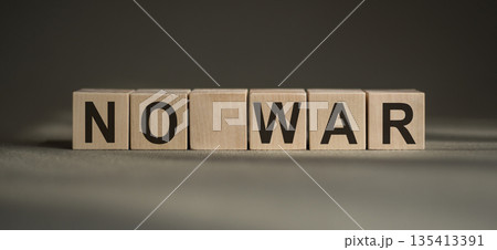 Text NO WAR on wooden cubes. No aggression. Square wood blocks. Text NO WAR on wooden cubes. No aggression. Square wood blocks. 135413391