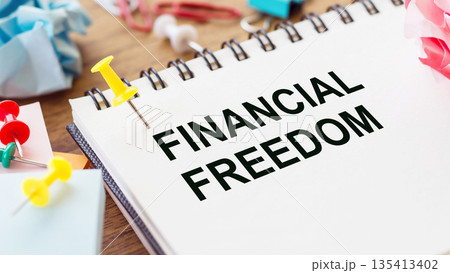 Text financial freedom on note paper on office table 135413402