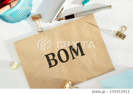 BOM - Bill Of Materials acronym on notepad, business concept background 135413411