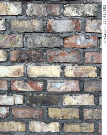 Close up view of a weathered brick wall texture, a vintage construction material 135413602