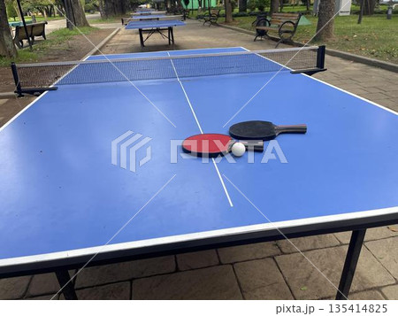tennis racket on the table for leisure activities 135414825