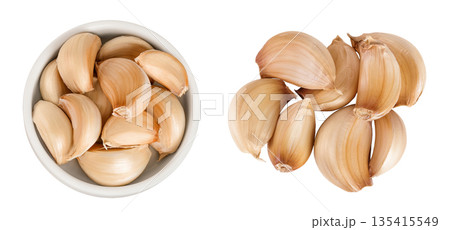 garlic cloves in ceramic bowl isolated on white background close up. Top view. Flat lay. garlic cloves in ceramic bowl isolated on white background close up. Top view. Flat lay. 135415549